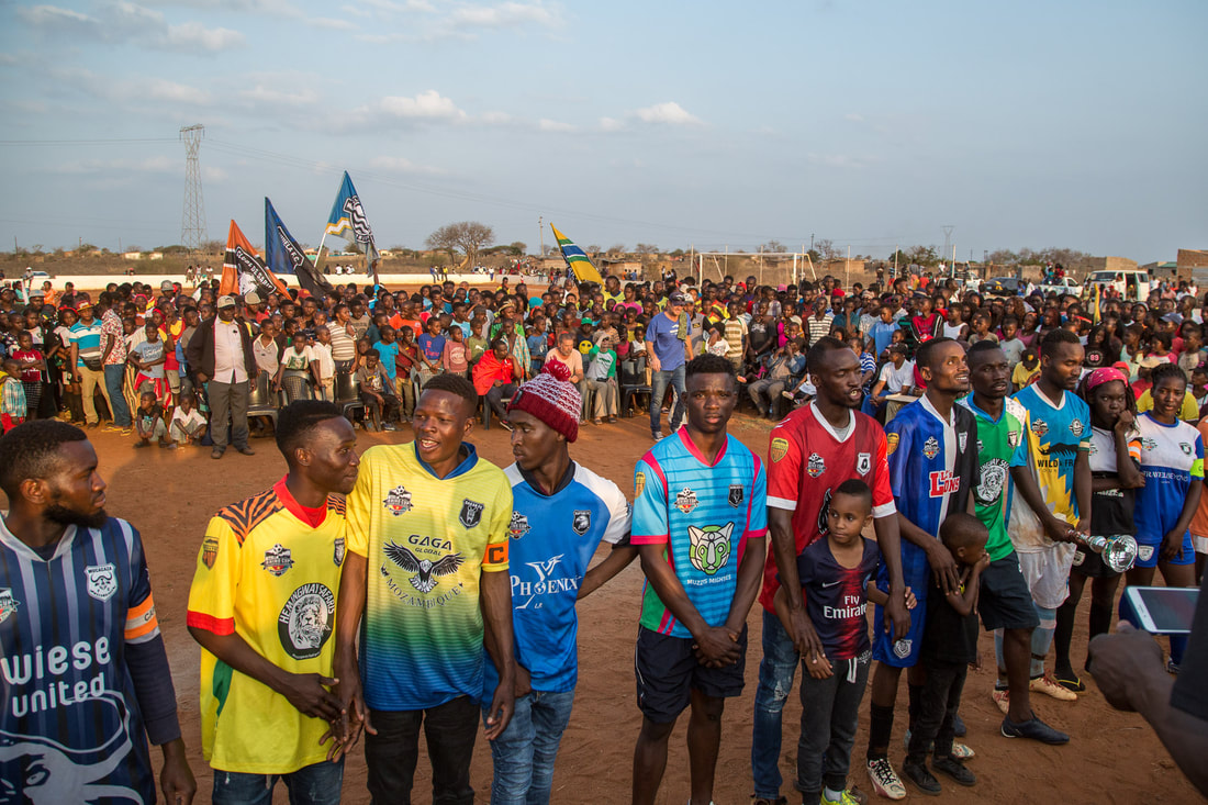 This image captures the unity of twenty-four soccer teams. Representing the communities of Sabié, Mozambique. This photo was taken at the closing ceremony  of the 2019 Rhino Cup Champions League.