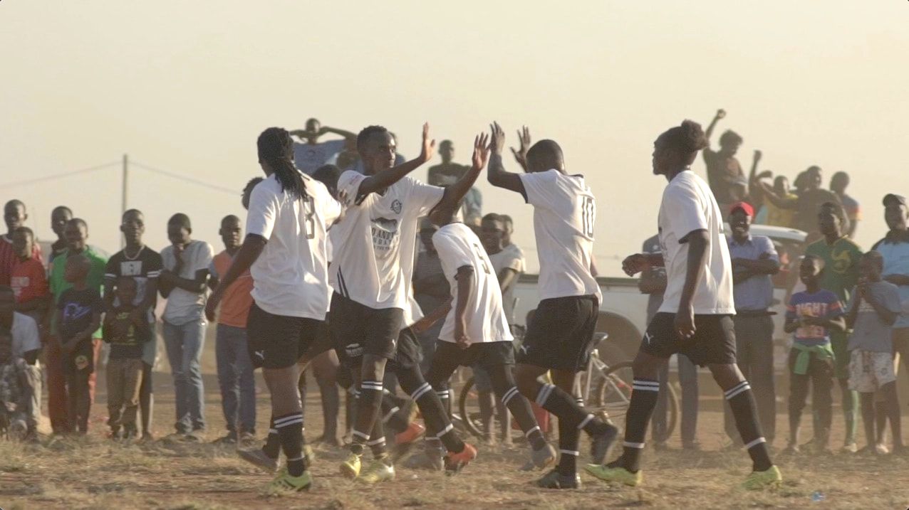 Soccer players from Club de Corumana celebrate a goal scored against Tchuela FC in the 2017 Rhino Cup finals. The beginnings of a journey to the Rhino Cup Champions League are on display here.