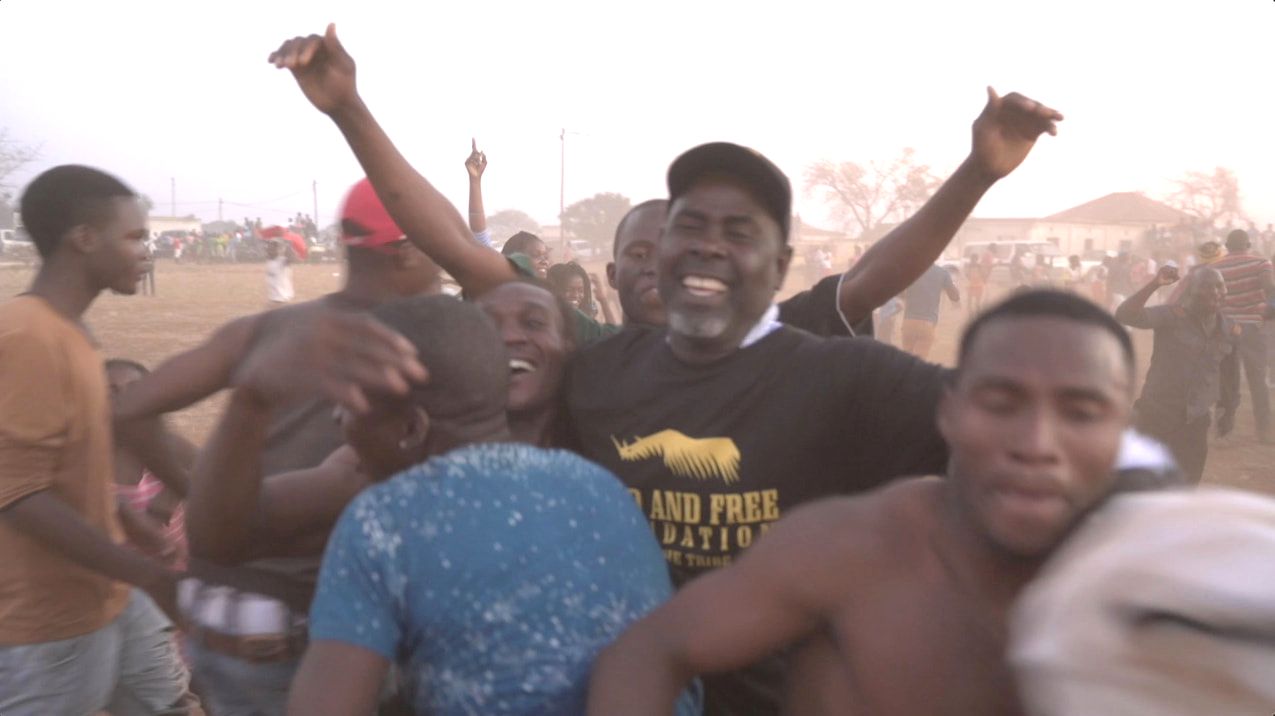 Club de Corumana soccer supporters and players celebrate their victory over Tchuela FC in the 2017 Rhino Cup finals. The beginnings of a journey to the Rhino Cup Champions League are on display here.