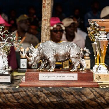 The Community Designed championship trophy reads: ​“Young People Free from Poaching.”