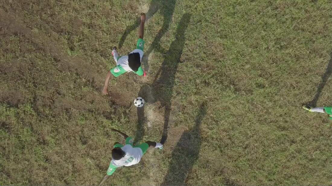 An aerial image from the opening day of the Rhino Cup Champions League in April 2018. Agri-Sul Football Club opens the day with the kick-off for the league season.