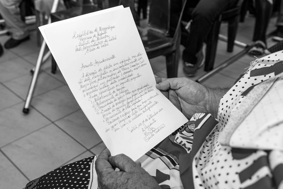 This photo captures the moment a member of WFF received the original handwritten document of the 
