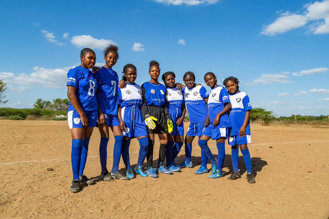The female soccer team, Peregrinas de Sabie F.C., posed for this team photo just before the very first kick-off of the Women's Rhino Cup Champions League 2019. Peregrinas de Sabie is sponsored by Travel Beyond