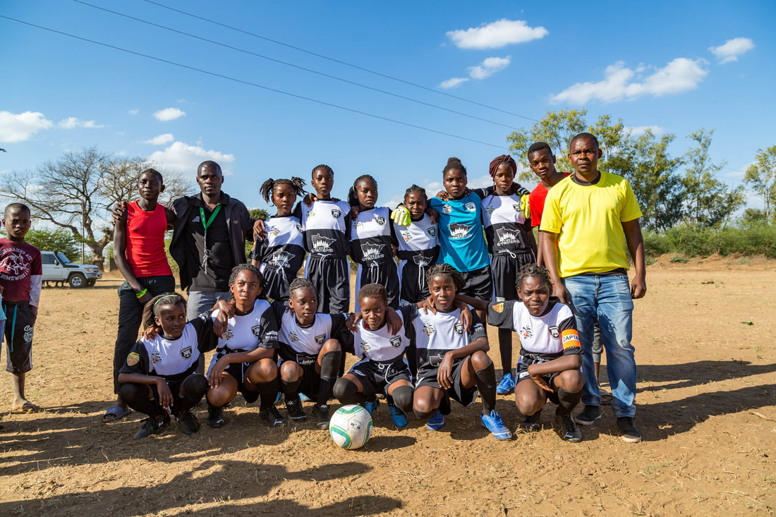 The female soccer team from Academia de Chavane F.C., posed for this team photo before their very first clash with Peregrinas de Sabie F.C. in the first game of the Women's Rhino Cup Champions League 2019.  Academia de Chavane F.C is sponsored by Avenues & Acres Home Team.