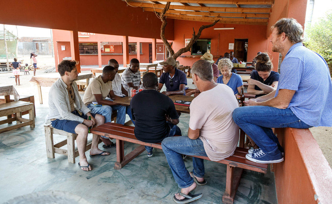 The Rhino Cup Champions League committee is meeting with Wild and Free Foundation members and sponsors. WFF meets with the RCCL committee in a small restaurant in Sabié, Mozambique, known locally as 